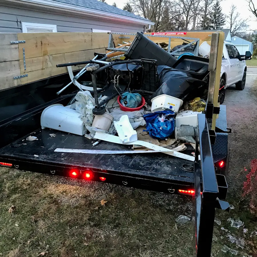 Roll-off dumpster delivered to a residential driveway in Farmingdale